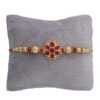 Alluring Gold Plated Floral and Pearl Rakhi (Bracelet) with Roli Chawal & Greeting Card